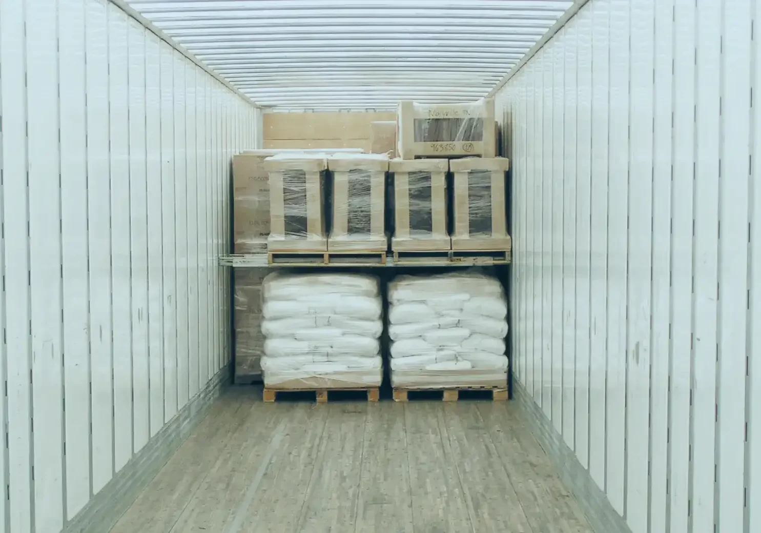 Stacked pallets in cargo container