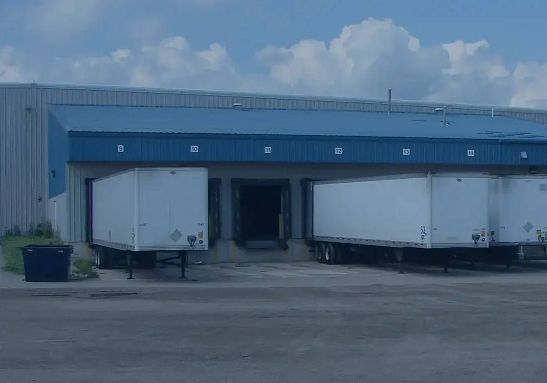 Large trucks parked at warehouse