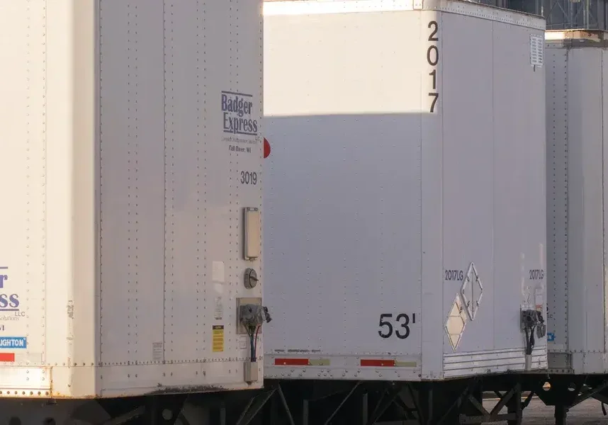 Row of trailers with company logos